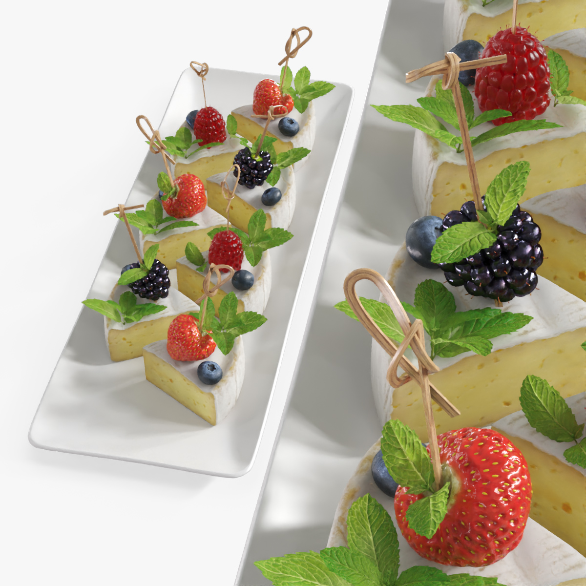 Brie Pieces with Fresh Berries and Mint on Plate White